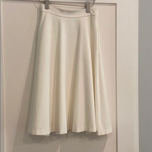 Full white midi skirt with pockets.